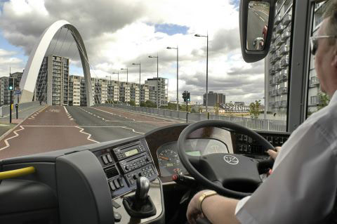 Coach driver makes his way across the Clyde Arc Bridge in Glasgow