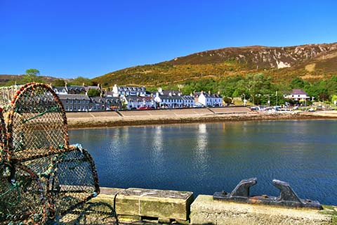 Attractive white-washed buildings line the harbour at Ullapool 