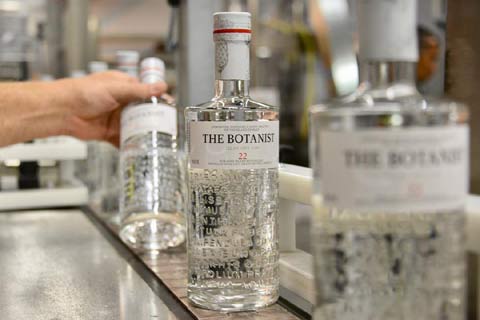 Bottles of Botanist Gin come off the production line at the distillery