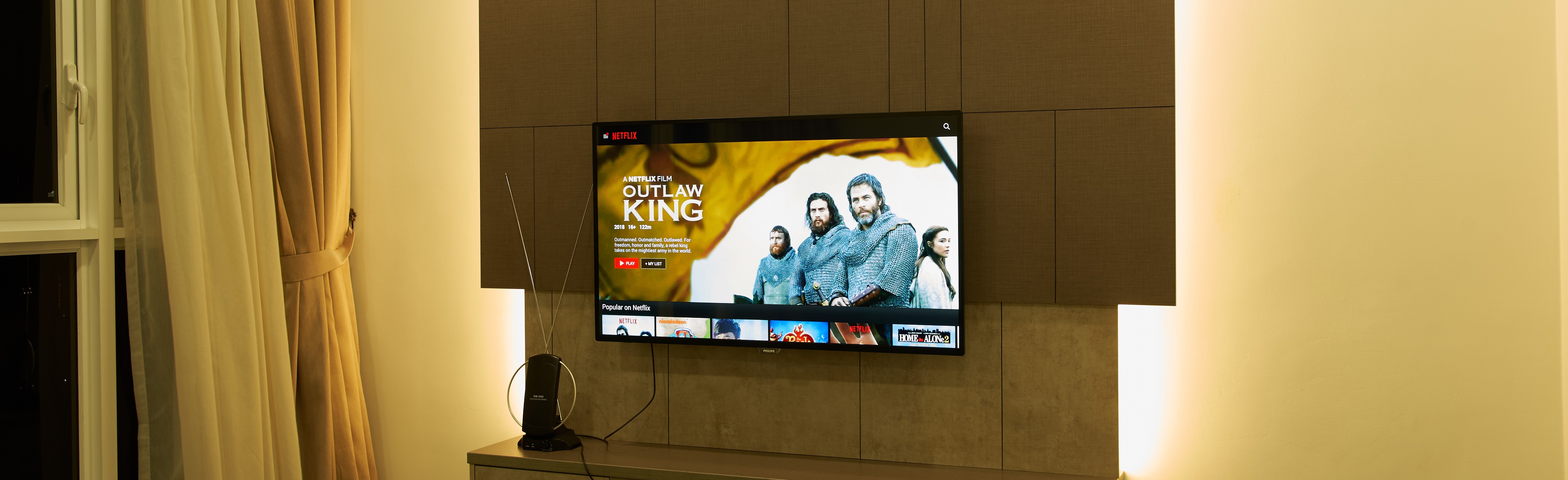 Television showing a trailer for The Outlaw King