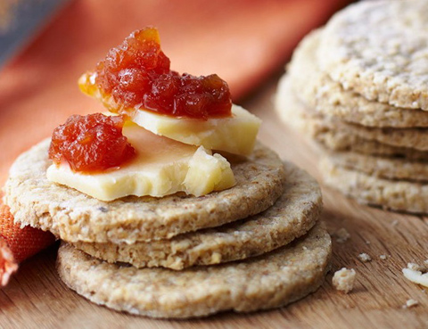 Stack of oatcakes with cheese and chutney