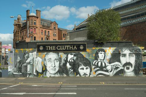 Mural painted on the walls of the Clutha Bar showing famous Glaswegians