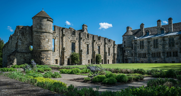 The ruins of Falkland Palace and attractive gardens on a summer day