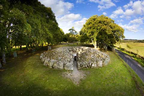 Circular burial chamber at Clava Cairns surrounded by trees