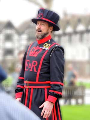 A beefeater dressed in their traditional uniform