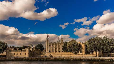 The spawling Tower of London seen from the River Thames