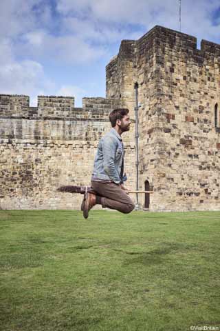 Man rides a broomstick at Alnwick Castle