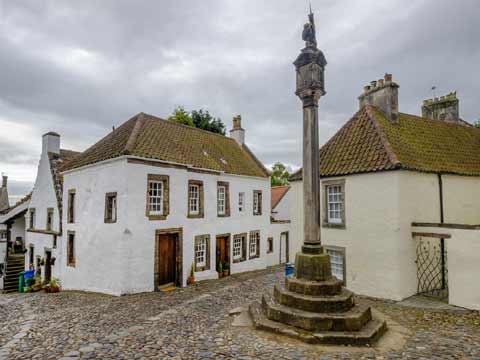 Ther Mercat Cross seen in the centre of Culross