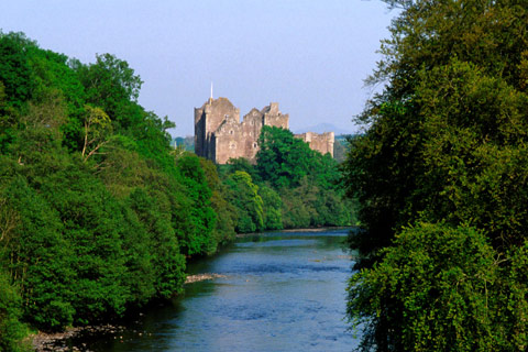 Doune Castle seen from the tree-lined banks of the River Teith
