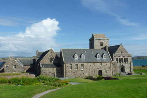 grey stone Abbey and nunnery on the isle of Iona on bright day
