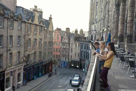 Three friends look down on Victoria Street