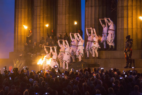 Performers descend from the National Monument on Calton Hill during the Beltane Fire Festival