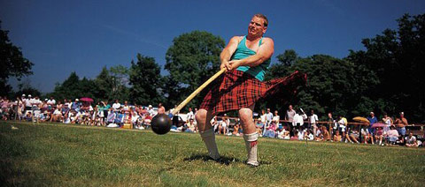 Kilted heavy-weight athlete competing in the Hammer-throw at a Highland Games