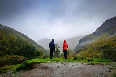A couple walking through Glen Nevis on a dreich day