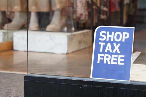 Shop Tax Free sign in a shop window