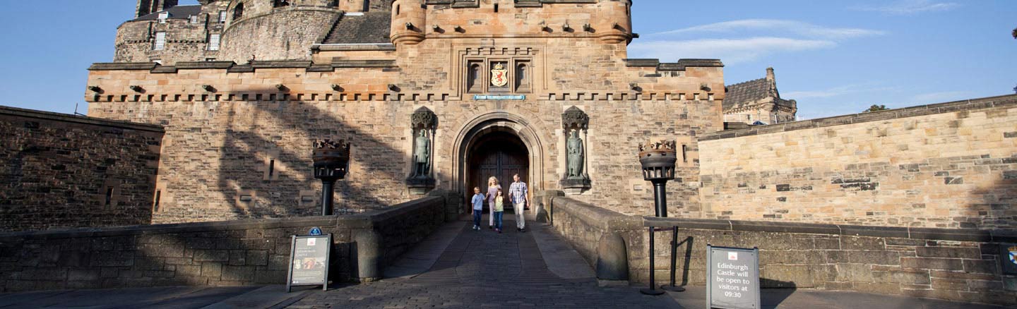 Family walk over the drawbridge of Edinburgh Castle