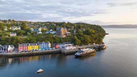 Ariel view of the colourful buildings overlooking Tobermory Bay