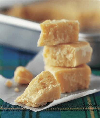 Pieces of tablet piled on a tartan napkin