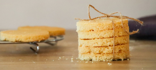 Stack of home-made shortbread cut into rounds and tied with string