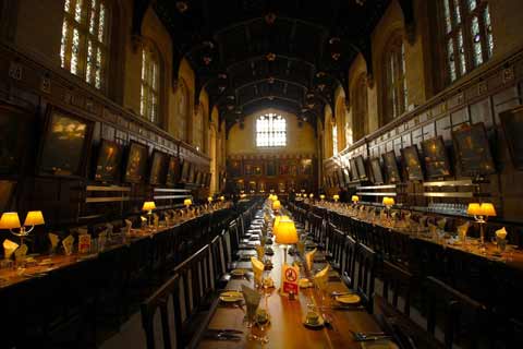 Wood panelled Christ Church Hall with tables set for dinner