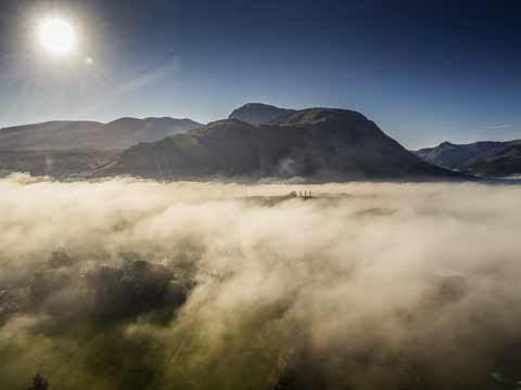 Ben Nevis towers above the early morning mist 