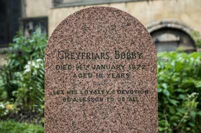 The grave of Greyfriars Bobby seen in Greyfriars Churchyard