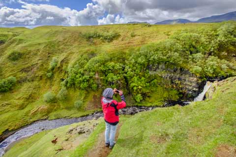 Photographer at the Lealt Falls