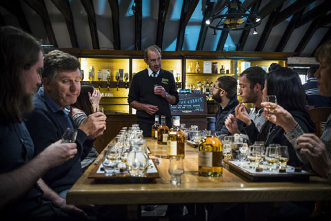 Visitors enjoy a tutored whisky tasting at Dalwhinnie DIstillery