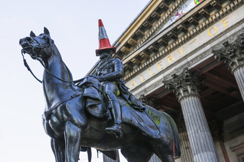 statue of Duke of Wellington with traffic cone on his head outside GOMA