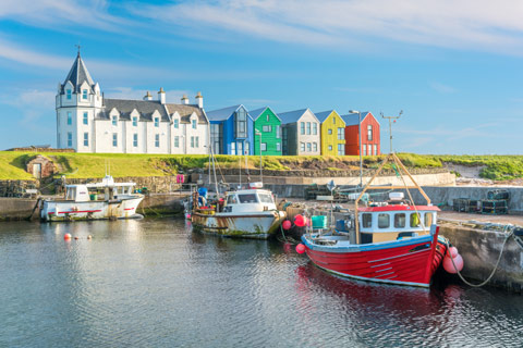 John O'Groats - boats in small harbour with colourful houses in the background