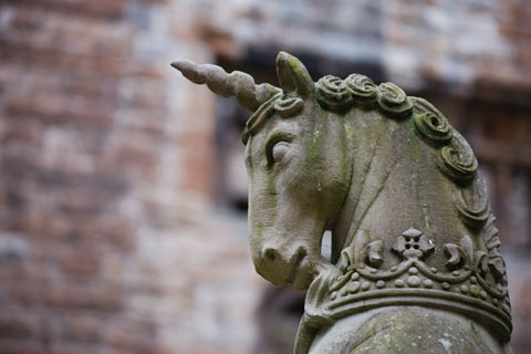 Head and neck of a Unicorn statue adorned with regalia