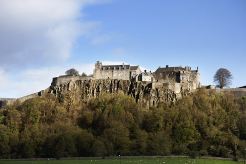 Cliff-top Stirling Castle overlooking the grounds of the Kings Knot