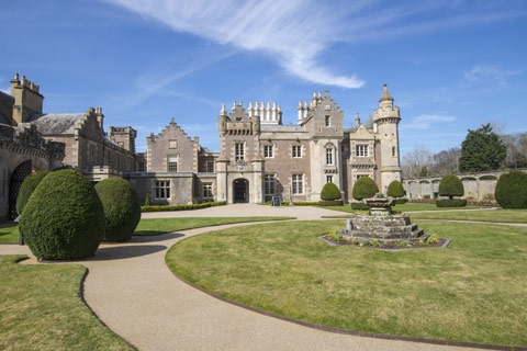 Formal gardens with sundial and trimmed hedges at Abbotsford House