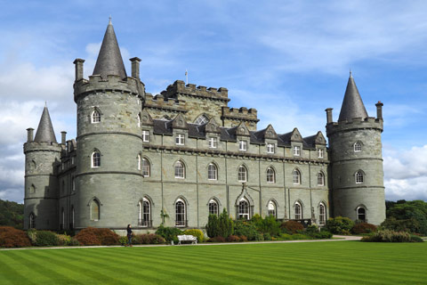 Inveraray Castle -   grand stone turreted castle set in manicured lawns